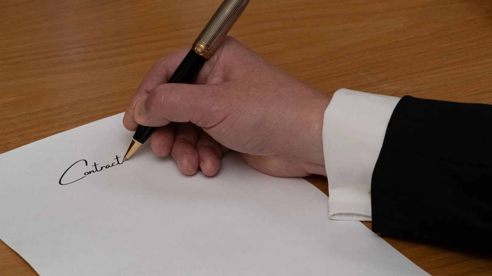 Legal documents and a pen on a desk